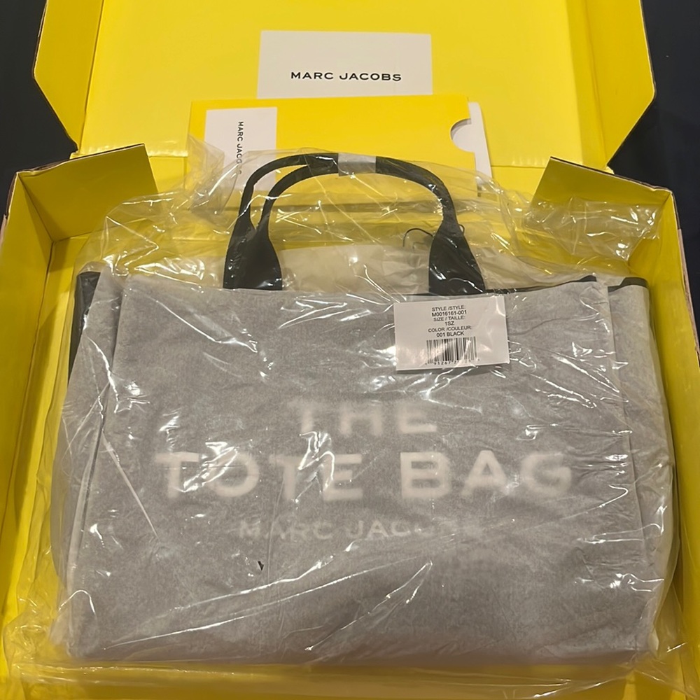 The medium canvas tote bag, brand new! In original box, and bag, unopened.